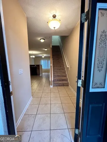 a large kitchen with cabinets and stainless steel appliances