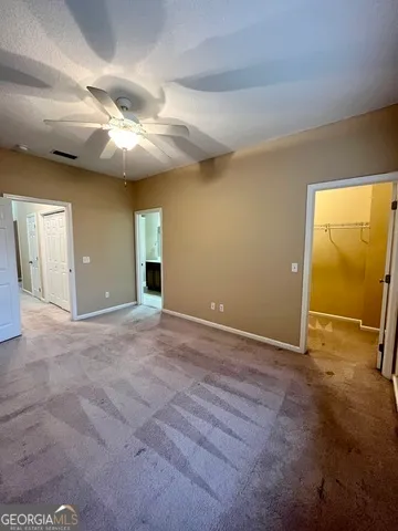 a view of an empty room with windows