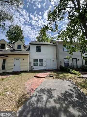 a bathroom with a double vanity sink toilet and shower