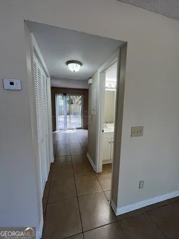 a kitchen with a cabinets and white appliances