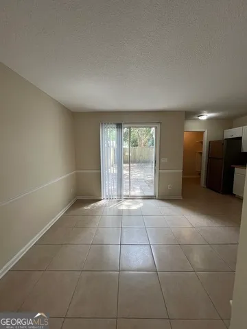a view of empty room with a fireplace