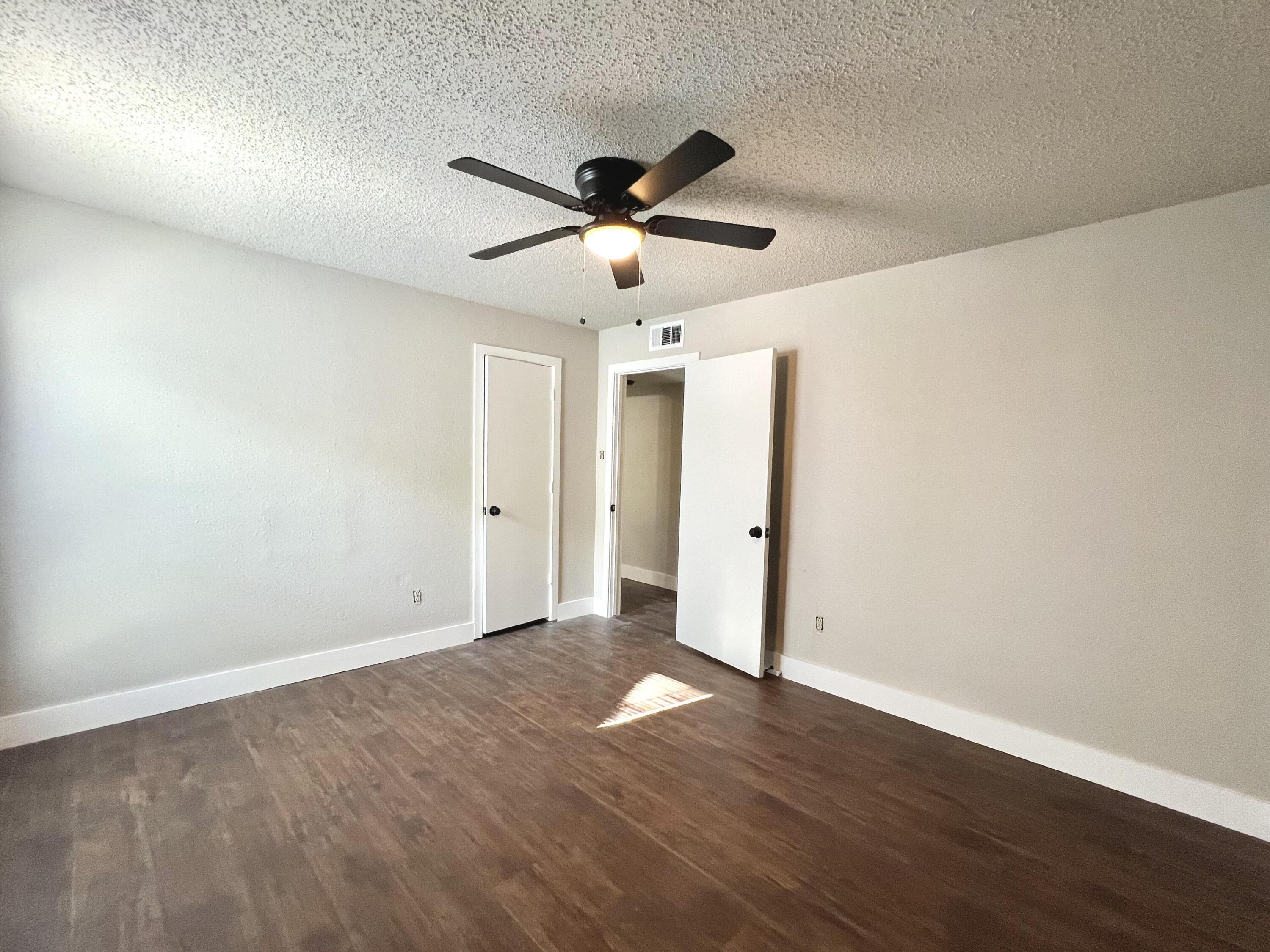 2620 25th Street Lubbock, TX 79410 - Photo 11 of 16 a view of an empty room and wooden floor