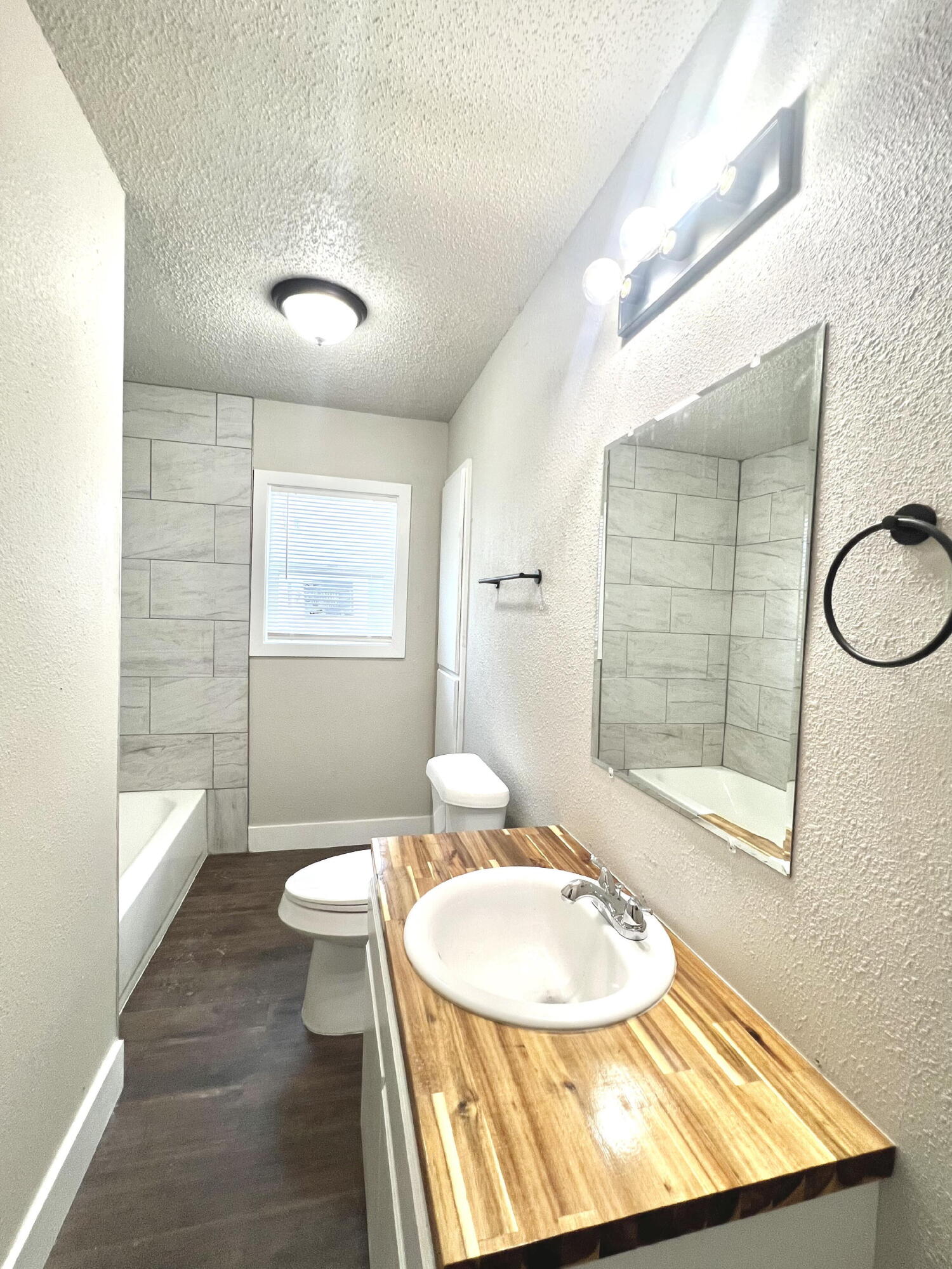 2620 25th Street Lubbock, TX 79410 - Photo 13 of 16 a bathroom with a sink toilet and shower