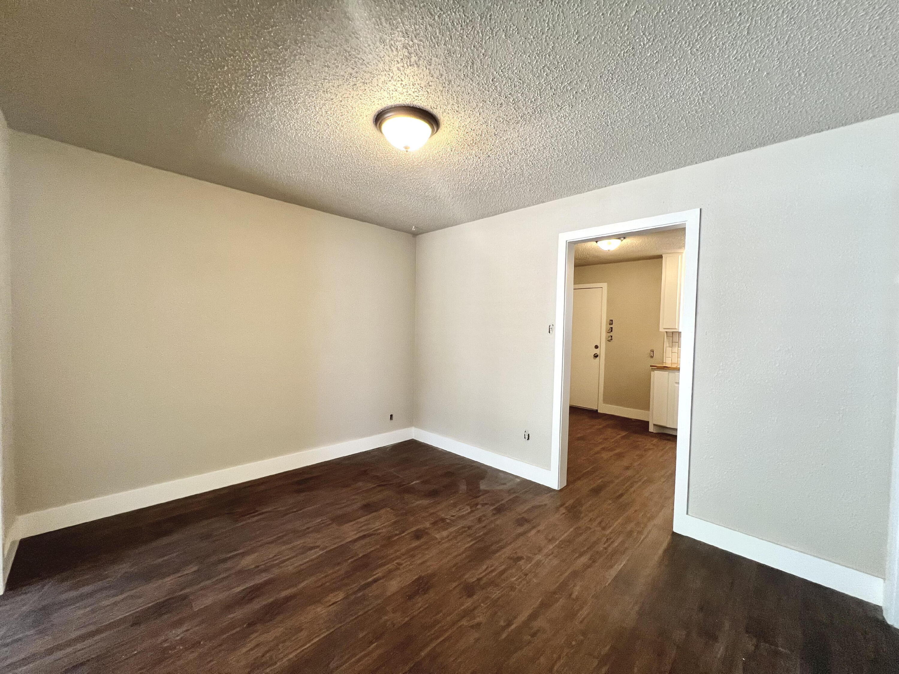 2620 25th Street Lubbock, TX 79410 - Photo 4 of 16 wooden floor in an empty room
