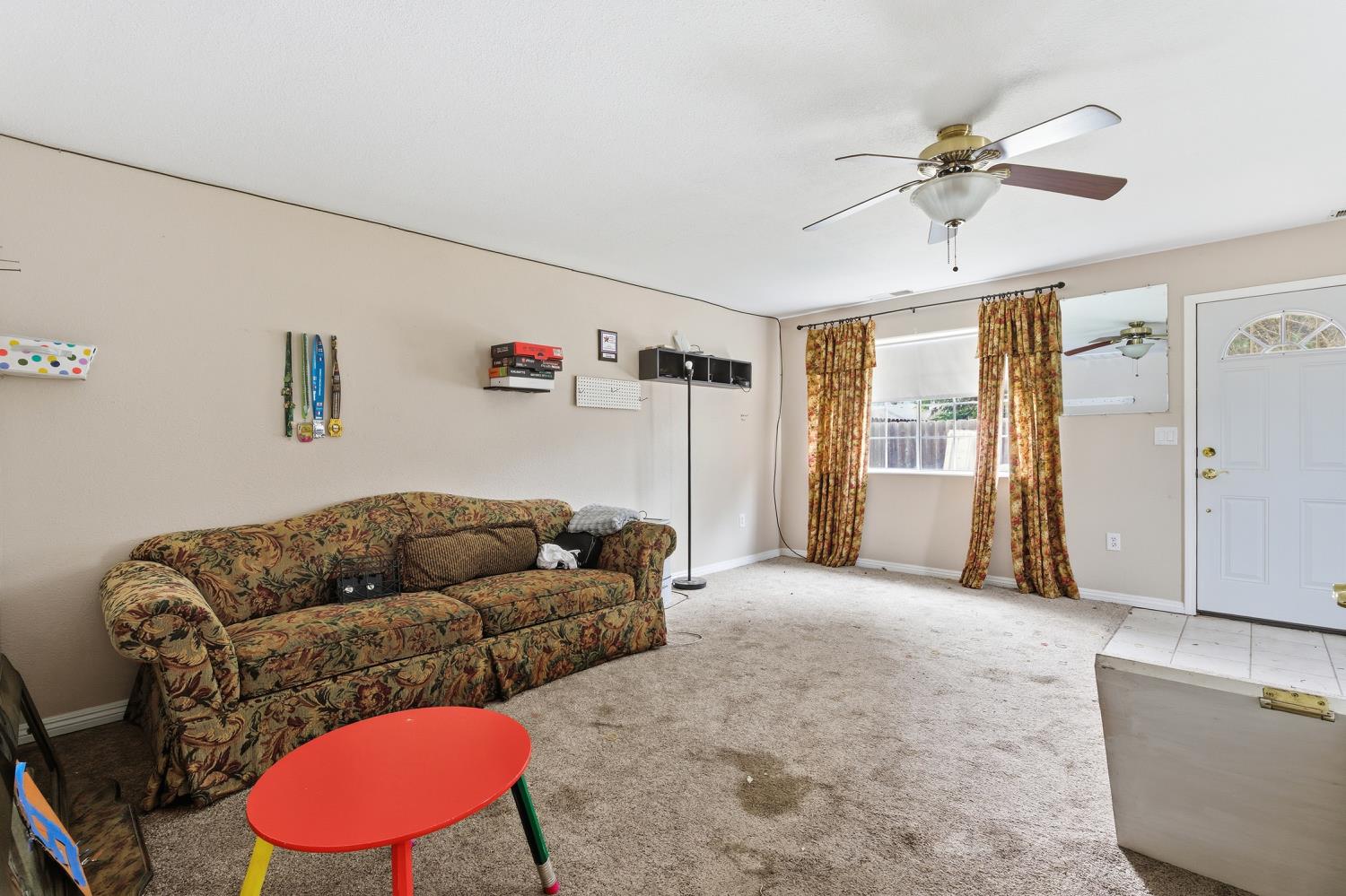 36313 Ave 12 Madera, CA 93636 - Photo 2 of 41 a living room with furniture and a window