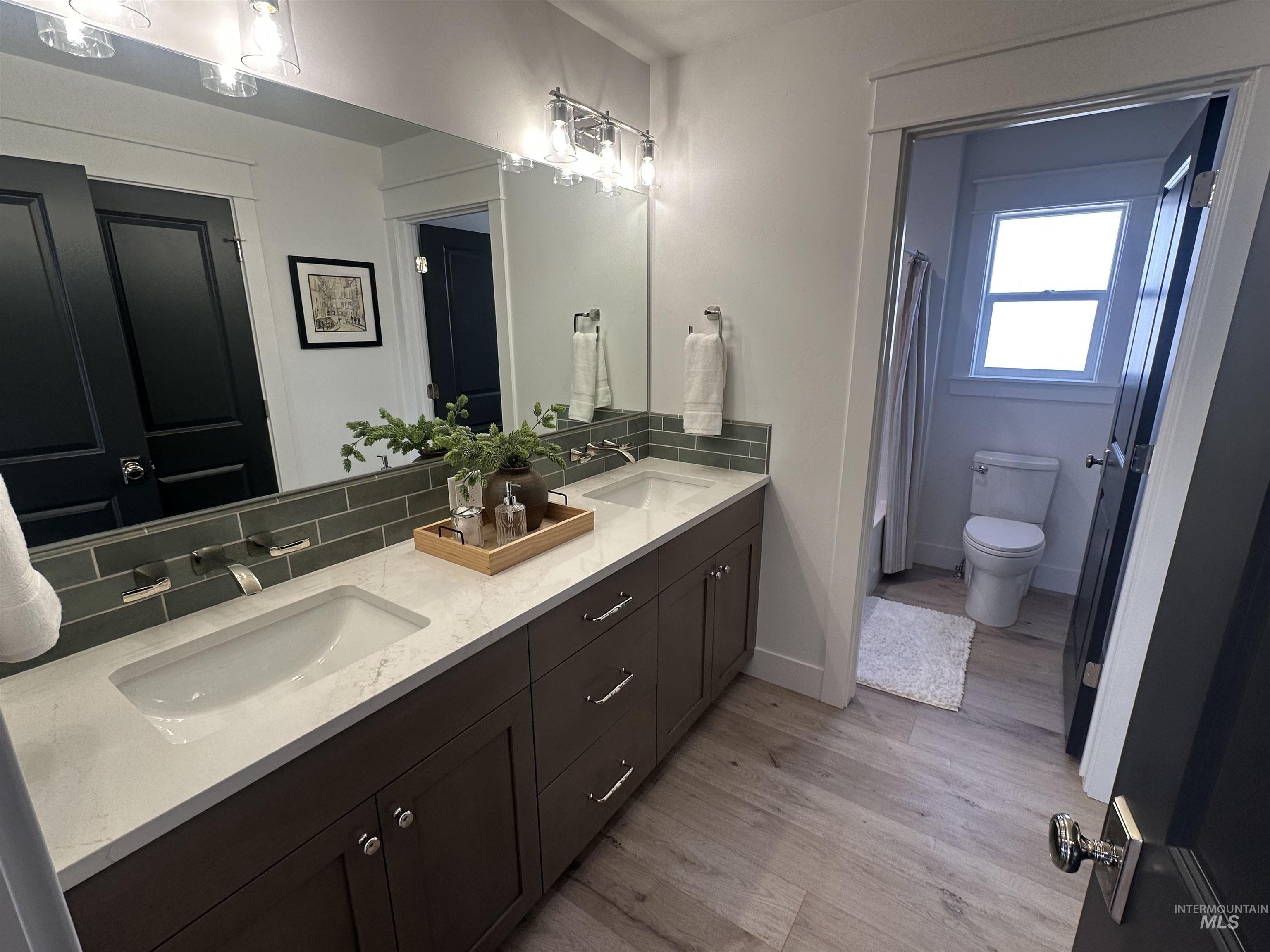 3035 Lake View Twin Falls, ID 83301 - Photo 31 of 41 Built-in white shelving unit spanning the wall, recessed lighting, light gray carpeting, and a black paneled door with hardware