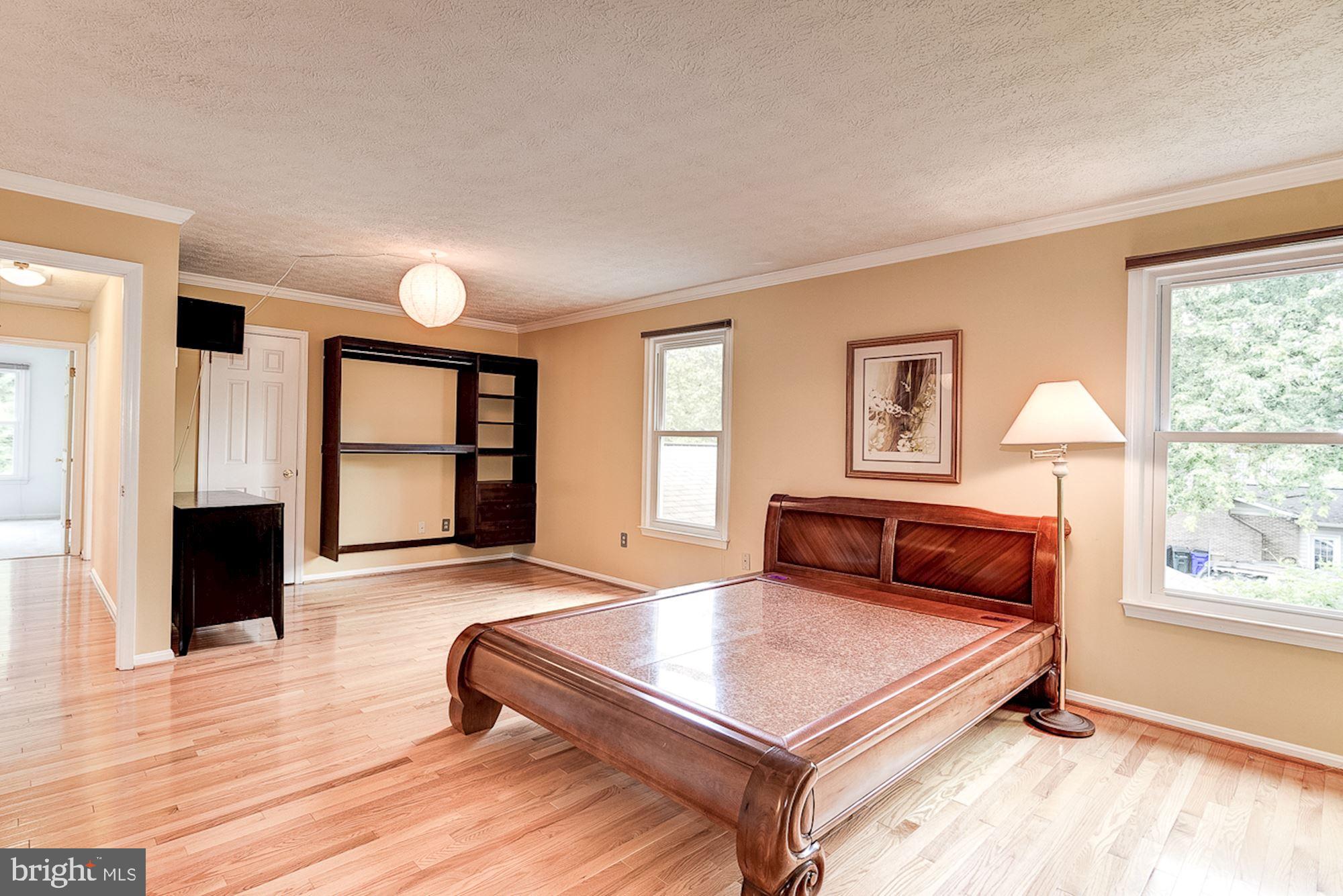 3221 Sharp Road Glenwood, MD 21738 - Photo 17 of 53 Primary Bedroom | Hardwood Floors | Walk-in Closet