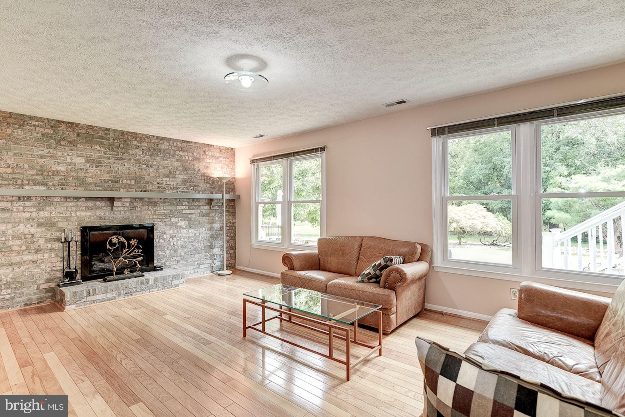 3221 Sharp Road Glenwood, MD 21738 - Photo 24 of 53 Brick Profile Fireplace | Hardwood Floors