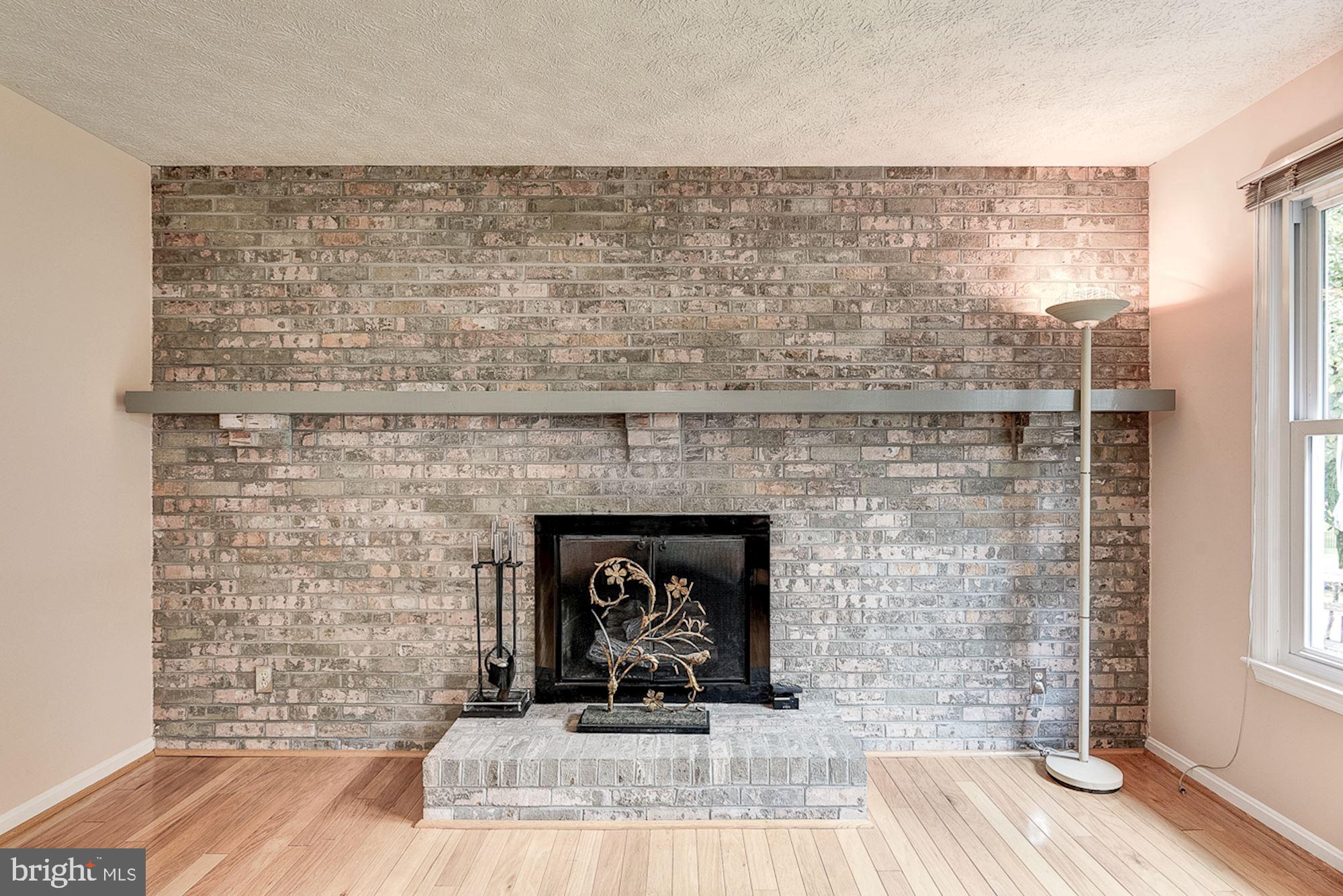 3221 Sharp Road Glenwood, MD 21738 - Photo 26 of 53 Brick Profile Fireplace | Hardwood Floors