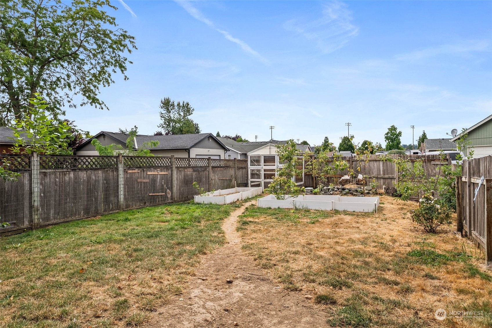 5500 Parker Road East Sumner, WA 98390 - Photo 23 of 29 a view of a house with a yard and sitting area