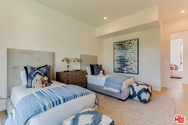 a bedroom with bed and a couch