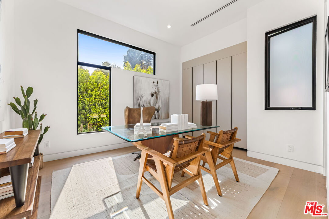 12119 Travis Street Los Angeles, CA 90049 - Photo 9 of 26 a dining room with furniture and window