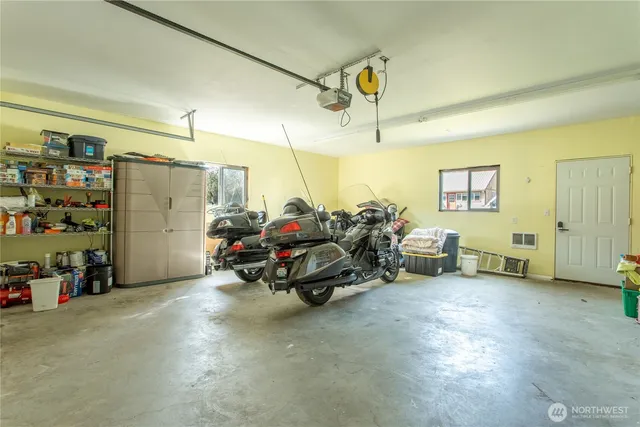 a view of a garage with a table and a chairs