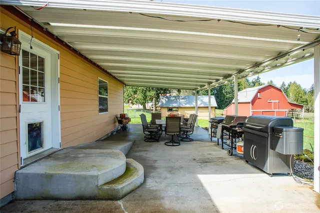 a view of a house with outdoor seating