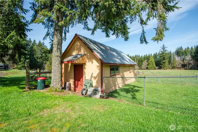 a view of a house with a yard and a garage