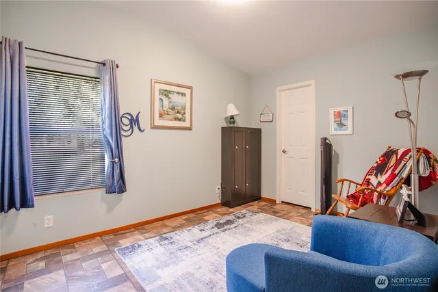 a bedroom with a bed and a couch