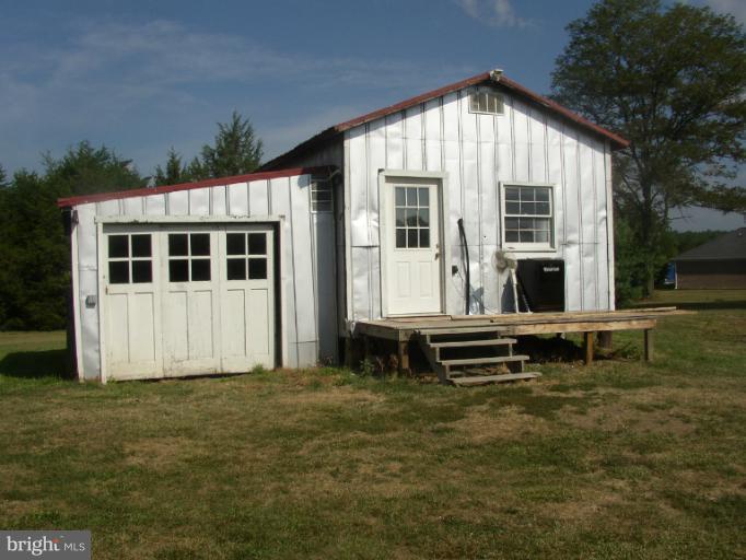 933 Guard Hill Road Middletown, VA 22645 - Photo 11 of 26 a front view of a house with a yard
