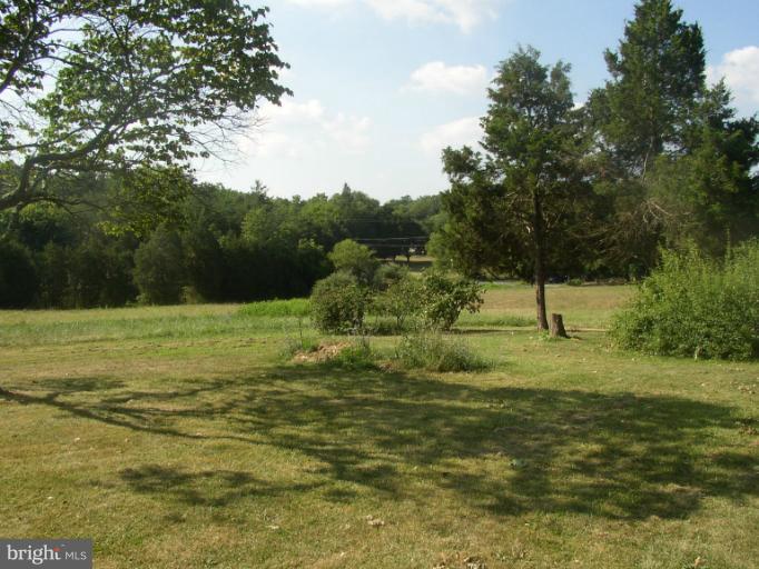 933 Guard Hill Road Middletown, VA 22645 - Photo 13 of 26 a view of a field with a tree