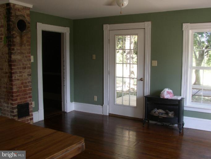 933 Guard Hill Road Middletown, VA 22645 - Photo 18 of 26 a living room with furniture and a window