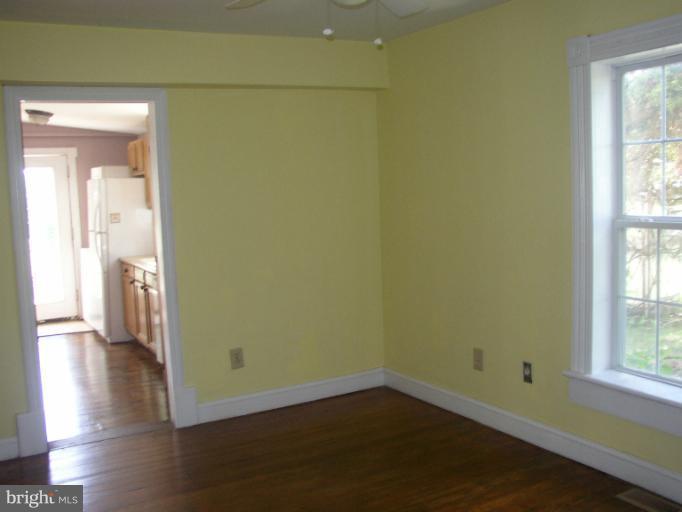 933 Guard Hill Road Middletown, VA 22645 - Photo 23 of 26 a view of a room with wooden floor and a window