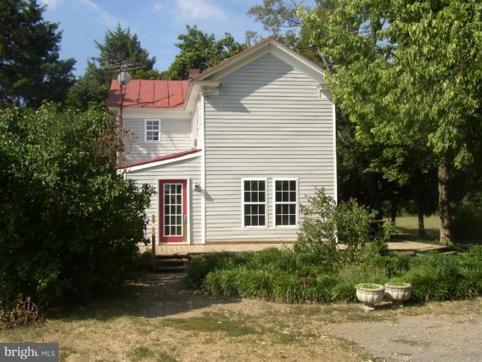 933 Guard Hill Road Middletown, VA 22645 - Photo 5 of 26 a view of a house with a yard and sitting area