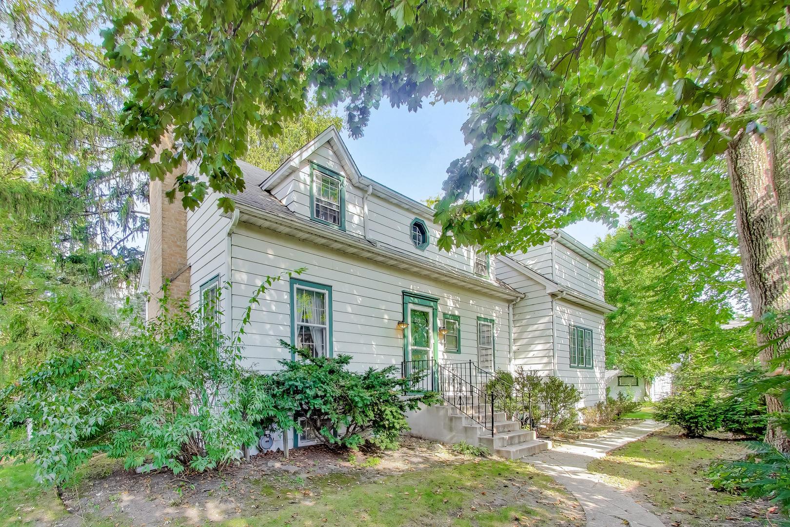 2113 Forestview Road Evanston, IL 60201 - Photo 1 of 18 a backyard of a house with outdoor seating and trees