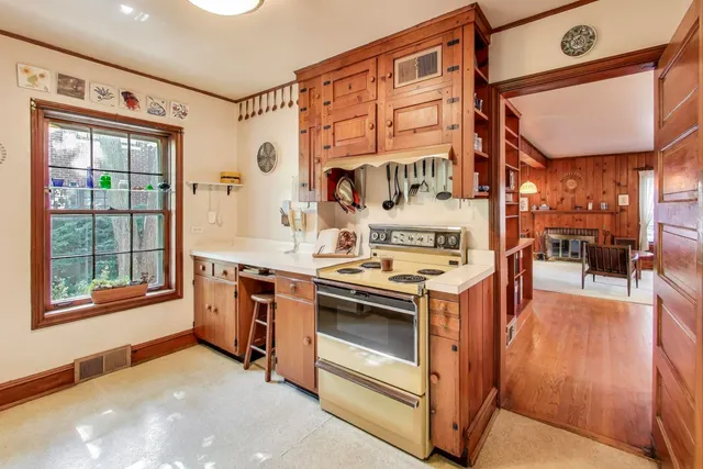 a kitchen with stainless steel appliances granite countertop a stove and a refrigerator