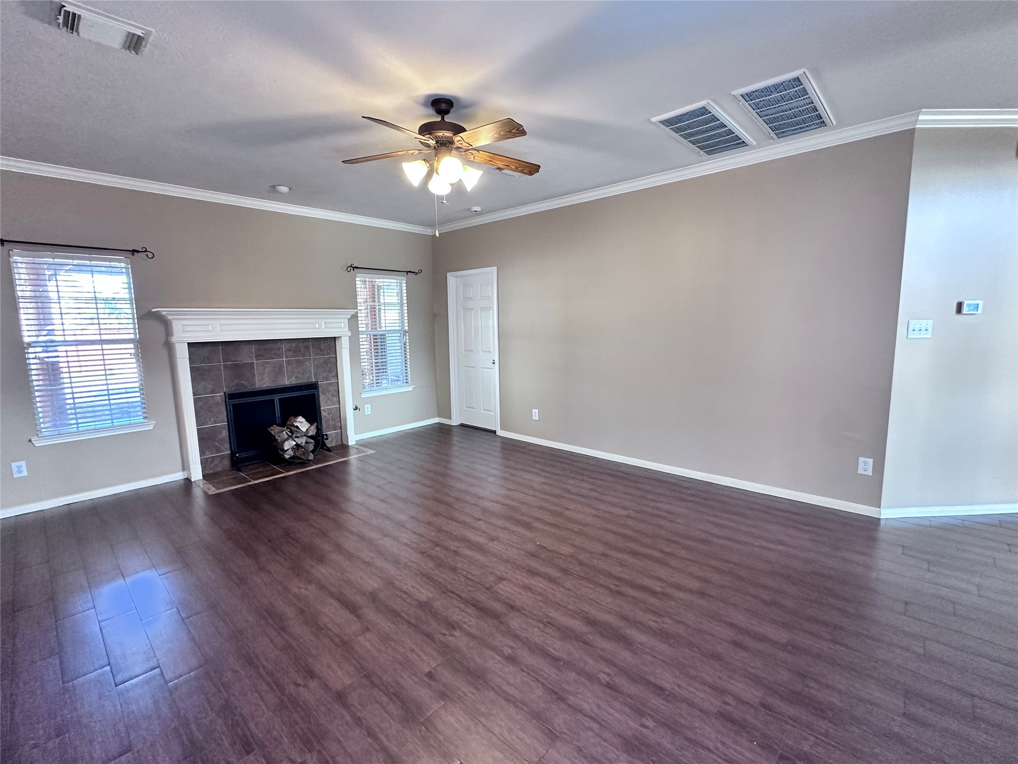 3411 Bay Breeze Drive Seabrook, TX 77586 - Photo 14 of 46 a view of an empty room with wooden floor fireplace and a window