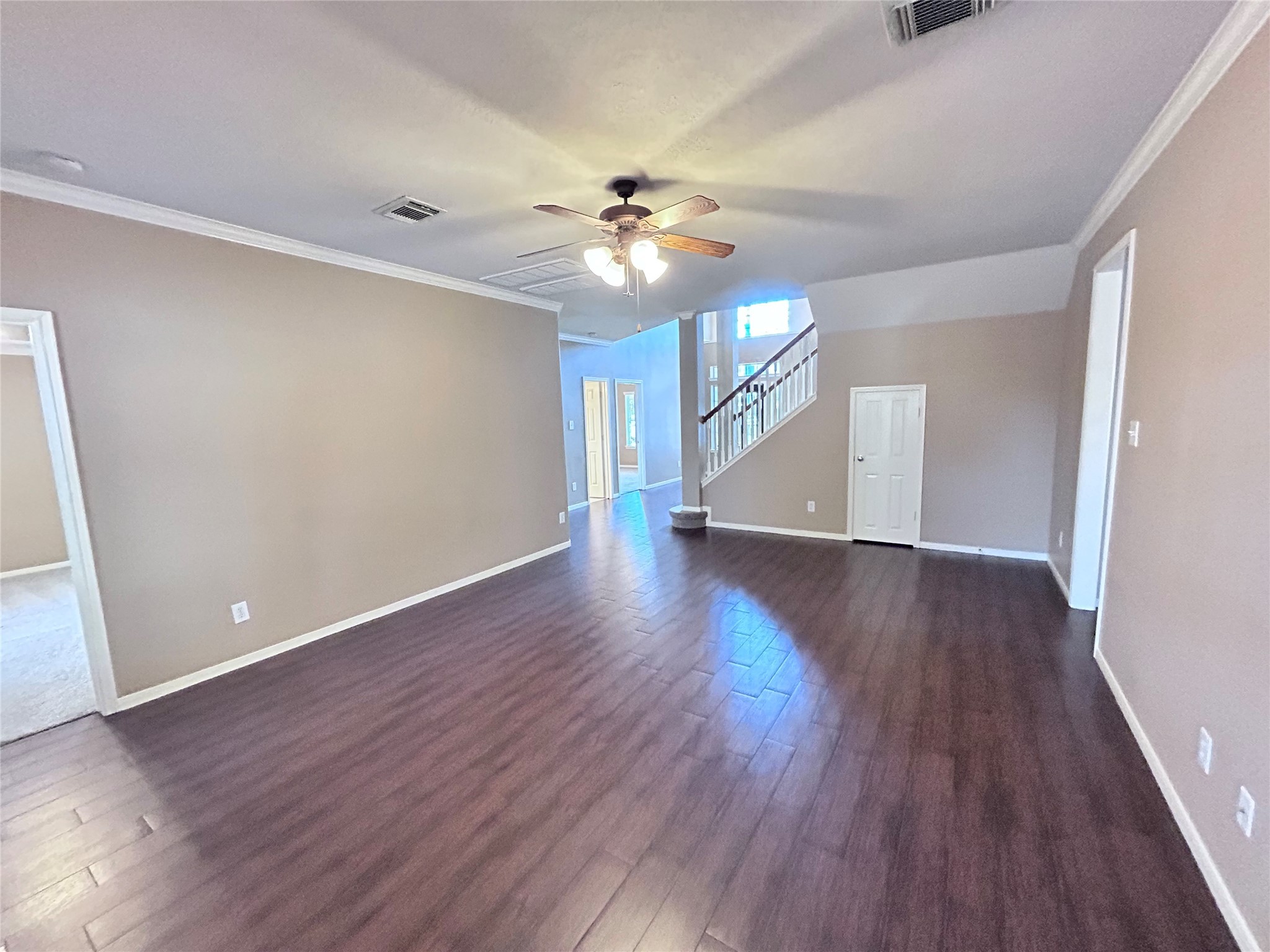 3411 Bay Breeze Drive Seabrook, TX 77586 - Photo 19 of 46 an empty room with wooden floor ceiling fan and window