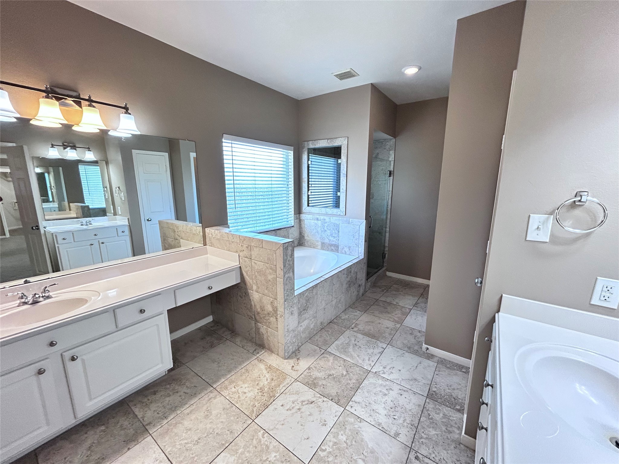 3411 Bay Breeze Drive Seabrook, TX 77586 - Photo 22 of 46 a bathroom with a double vanity sink a toilet and a mirror