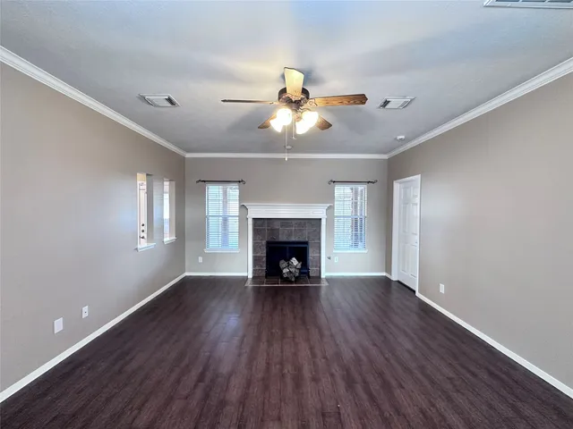 a view of an entryway with wooden floor and windows