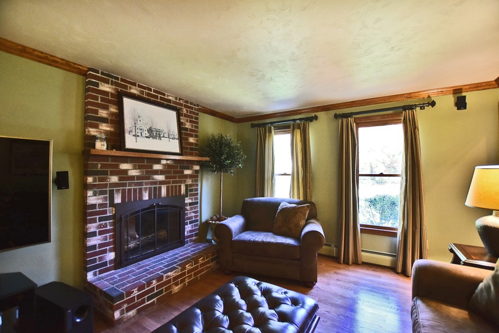 7 Rufus Putnam Place Rutland, MA 01543 - Photo 12 of 24 a living room with furniture a flat screen tv and a fireplace