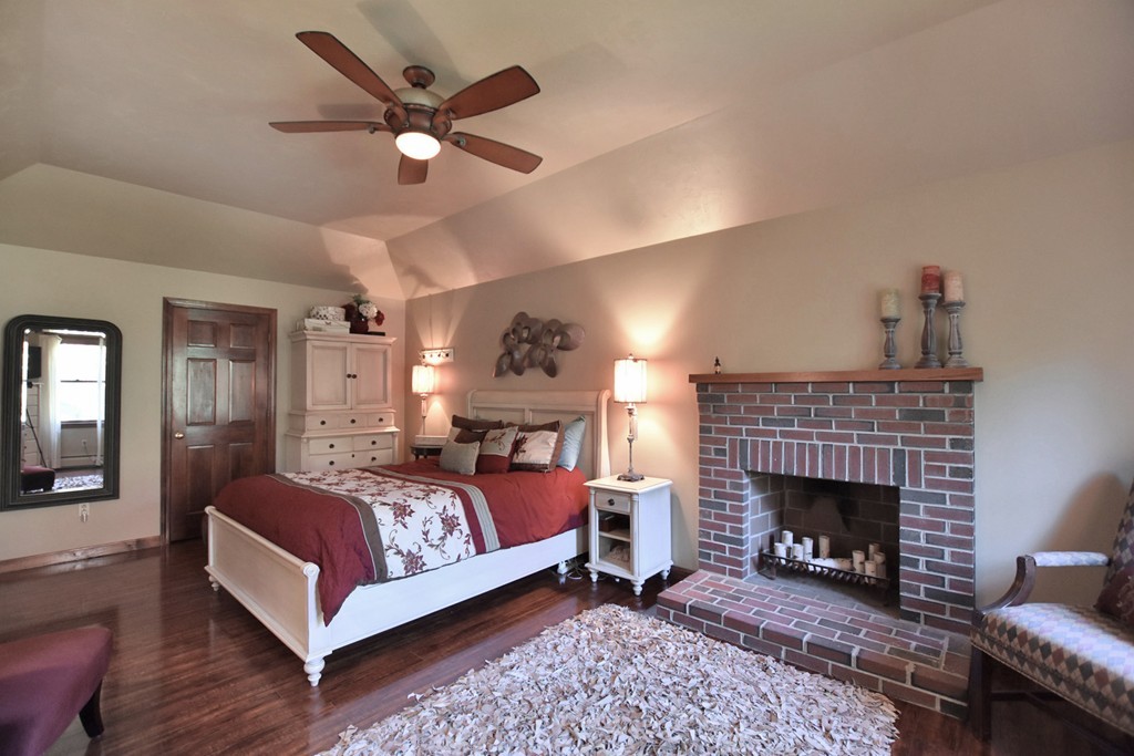 7 Rufus Putnam Place Rutland, MA 01543 - Photo 16 of 24 a bedroom with a bed and a fireplace