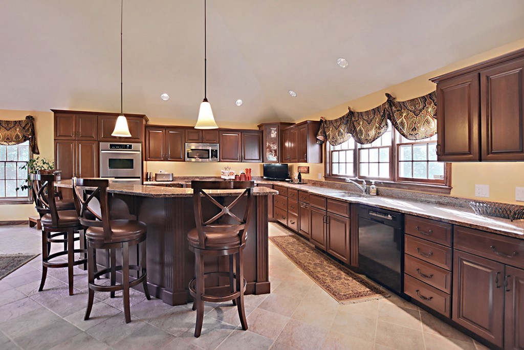 7 Rufus Putnam Place Rutland, MA 01543 - Photo 5 of 24 a kitchen with stainless steel appliances granite countertop table chairs sink and cabinets
