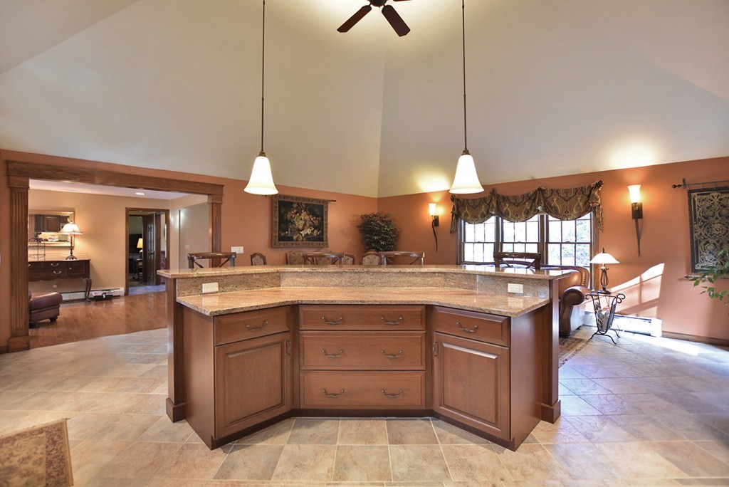 7 Rufus Putnam Place Rutland, MA 01543 - Photo 6 of 24 a kitchen with a stove and a wooden floor