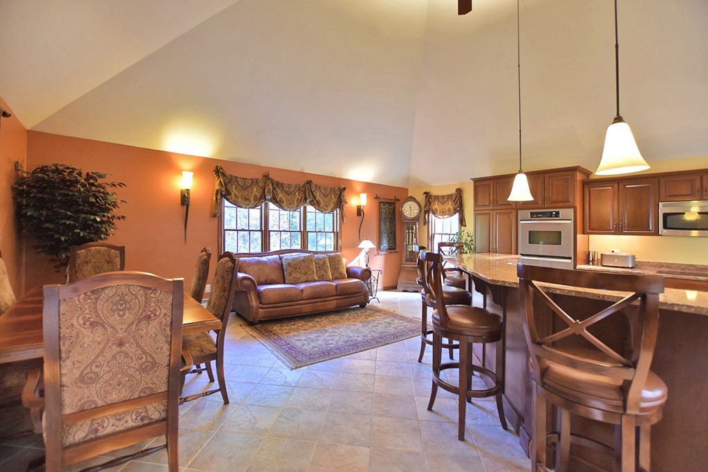 7 Rufus Putnam Place Rutland, MA 01543 - Photo 7 of 24 a living room with furniture a chandelier and a wooden floor