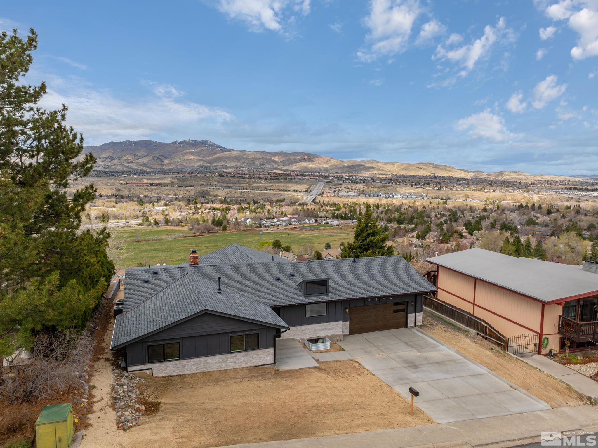 3145 Heatheridge Lane Reno, NV 89509 - Photo 3 of 39 an aerial view of a houses with city view