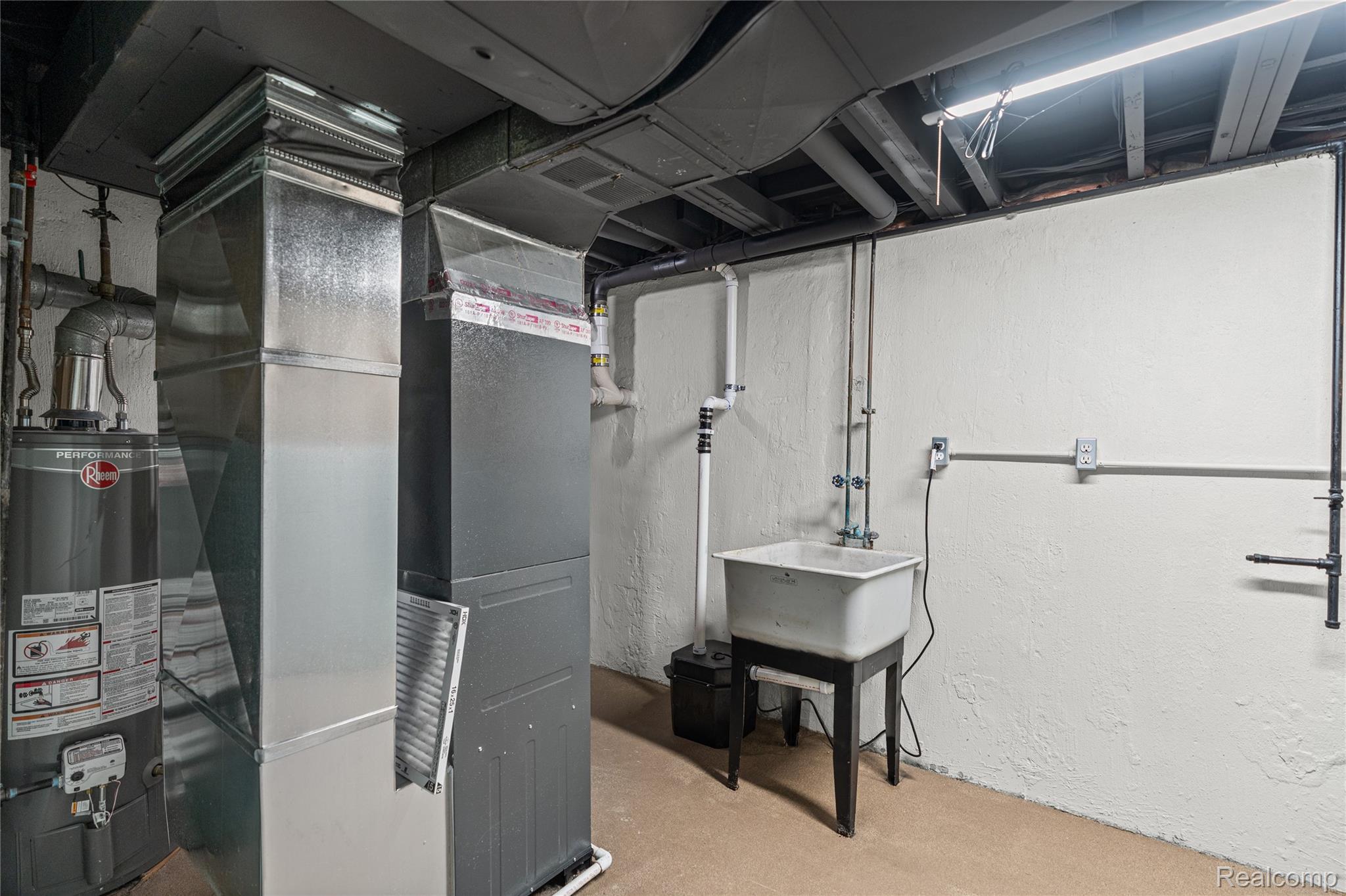 6273 Cold Spring Trail Grand Blanc, MI 48439 - Photo 42 of 48 Utility room featuring water heater and heating unit