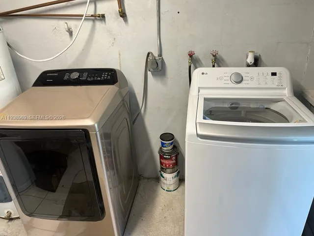 a utility room with dryer and washer