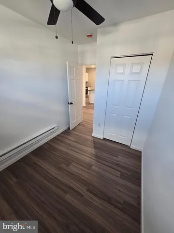 a view of hallway with wooden floor