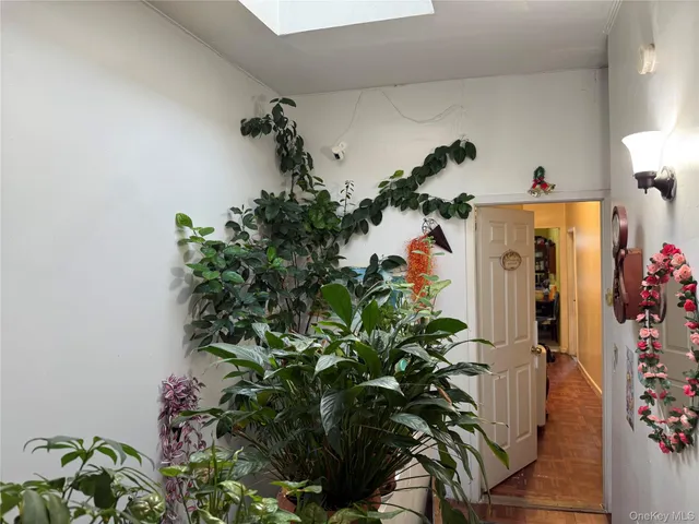 a vase of flowers sitting on a floor