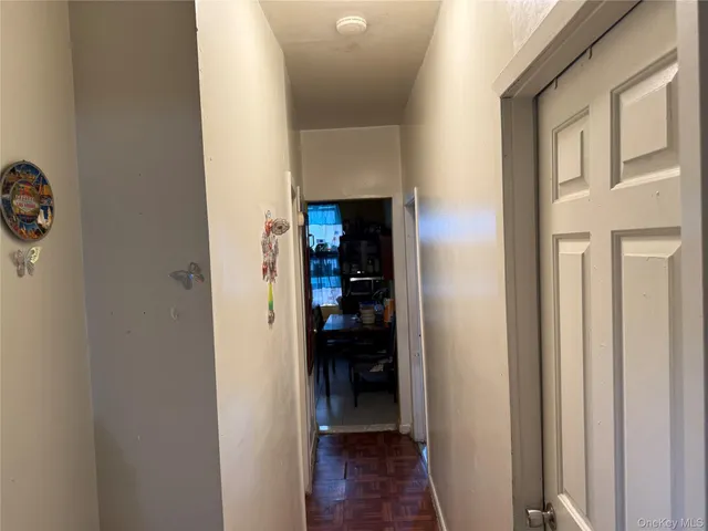 a kitchen with a sink and wooden cabinets