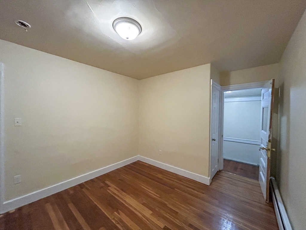 1911 River Street, Unit 2 Boston, MA 02136 - Photo 4 of 16 a view of a room with wooden floor