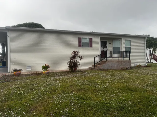 a house view with a backyard space