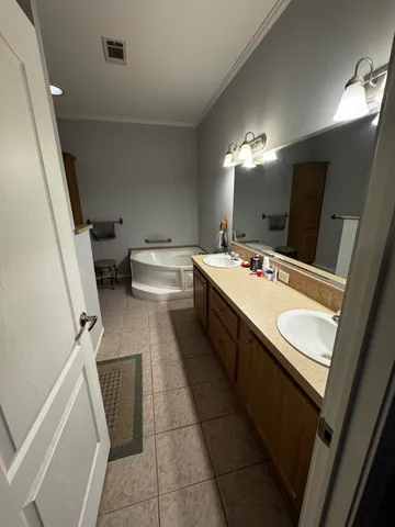 a bathroom with a sink a toilet a mirror and vanity