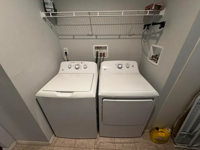 a utility room with dryer and washer