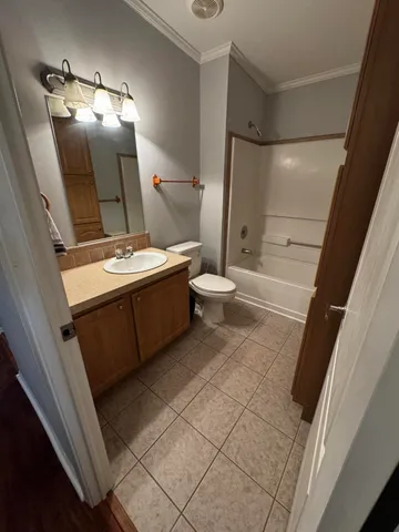 a bathroom with a sink and mirror with toilet