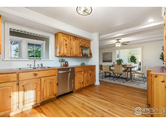 a spacious bathroom with stainless steel appliances granite countertop a sink and a large mirror