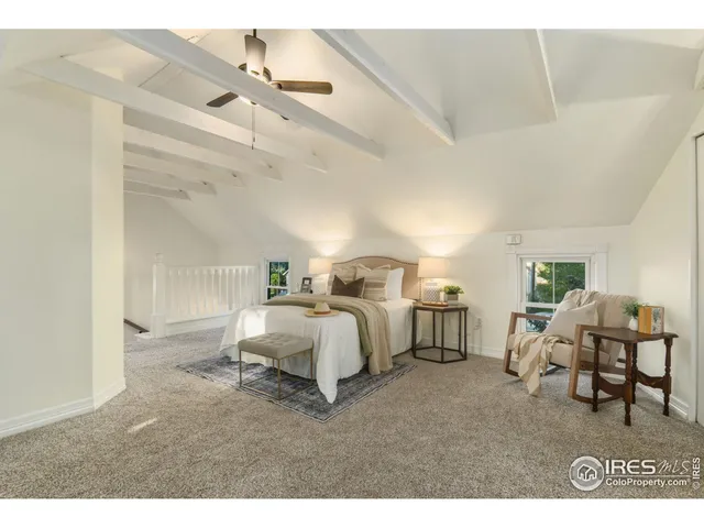 a spacious bedroom with a bed and furniture