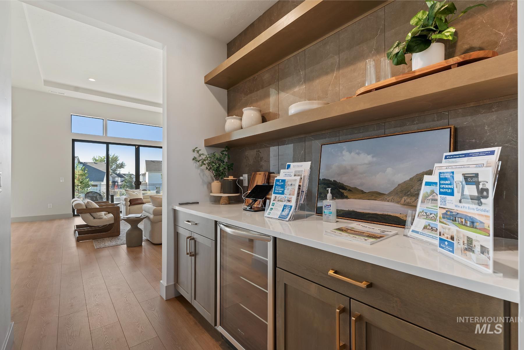 8530 West Graye Street, Unit SHASTA Meridian, ID 83646 - Photo 6 of 28 Kitchen featuring open shelves, beverage cooler, light wood-type flooring, dark brown cabinets, and recessed lighting